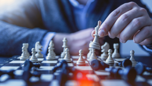 closeup of person playing chess